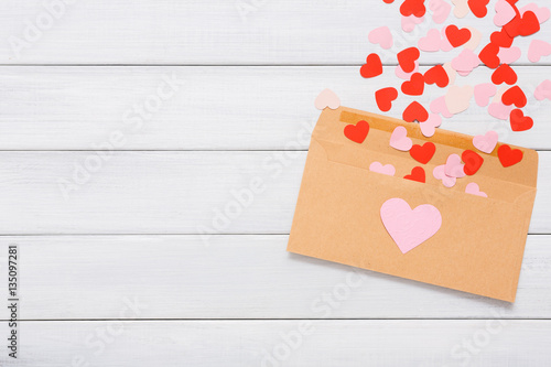 Valentine day love letter on white wood background