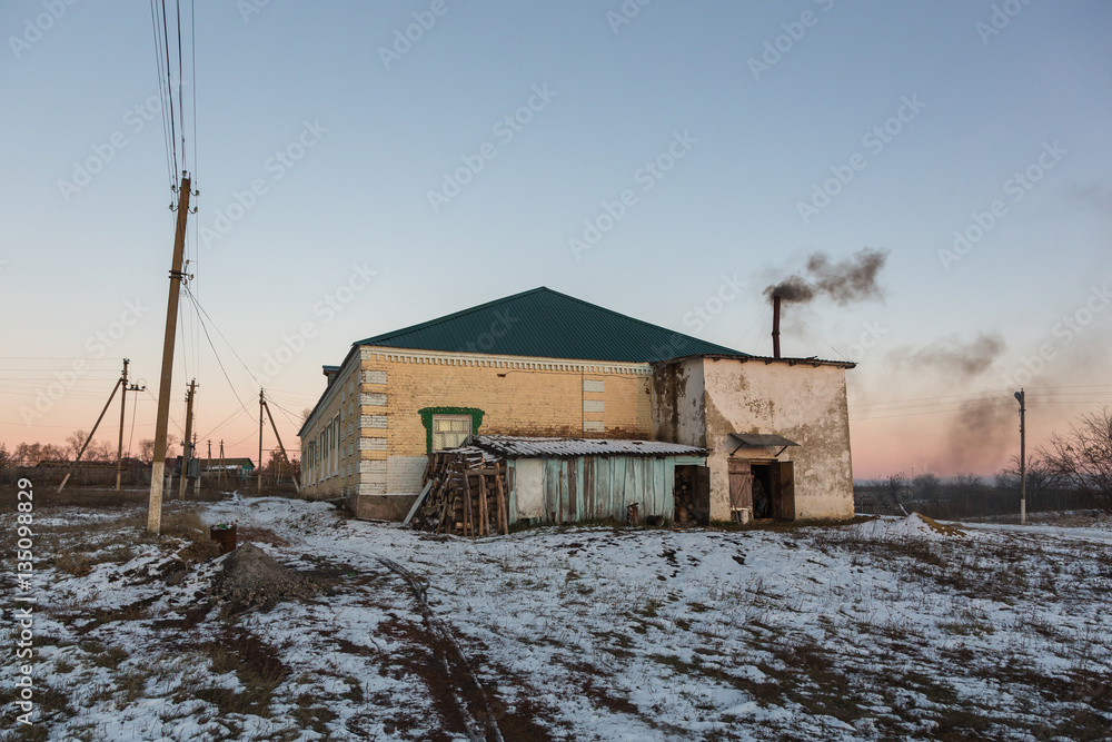 Winter sunset in russian village. Mikhaylovka Village, Penza Region, Russia.