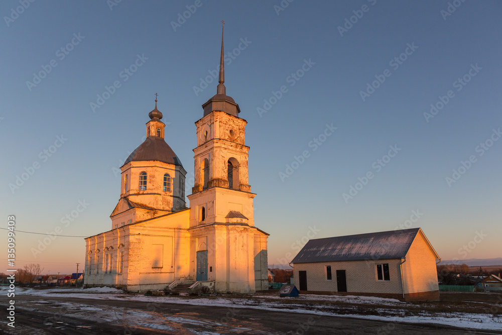 SIMBUKHOVO VILLAGE, PENZA REGION, RUSSIA - OCTOBER 31, 2015: Old Saint Michael the Archangel's Church at sunset. Built in 1780. SIMBUKHOVO VILLAGE, PENZA REGION, RUSSIA - OCTOBER 31, 2015: Old Saint Michael the Archangel's Church at sunset. Built in 1780.