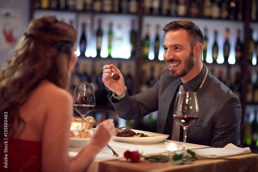 Couple enjoying together in restaurant Couple enjoying together in restaurant