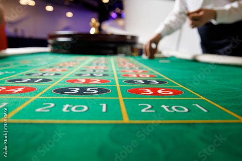 casino roulette tokens green table