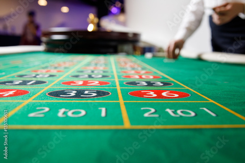 casino roulette tokens green table