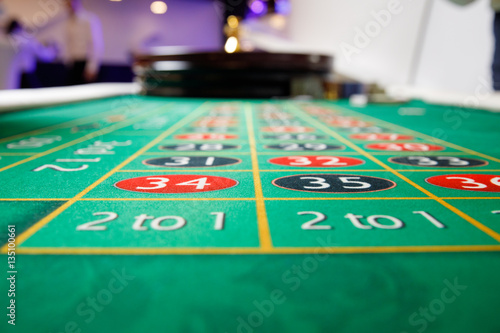 casino roulette tokens green table