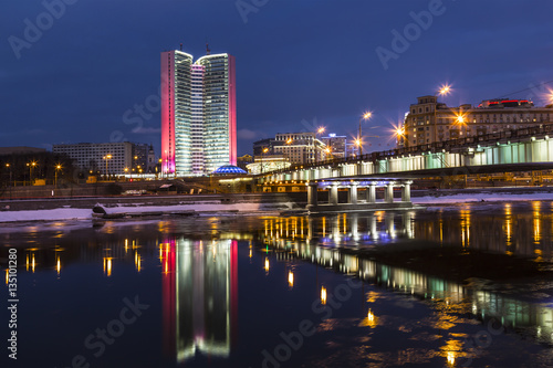 The view of the Government house of the Moscow  Novoarbatsky bridge and their reflection in the Moscow river  Moscow  Russia