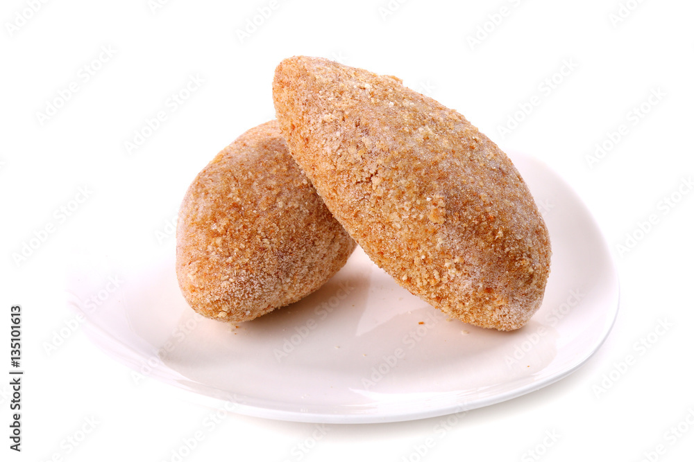 Frozen ground meat on a white plate Frozen ground meat on a white plate