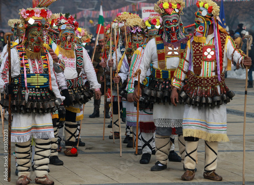PERNIK, BULGARIA - JANUARY 29, 2017 - Masquerade festival Surva in Pernik, Bulgaria. People with mask called Kukeri dance and perform to scare the evil spirits © georgidimitrov70