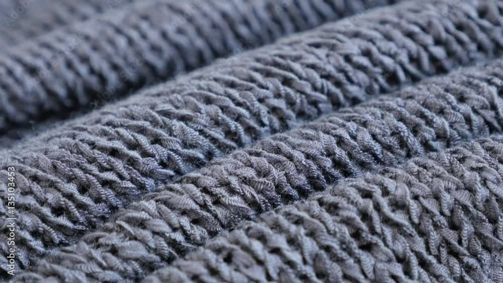 Gray knitwork fine texture close-up slow tilt 4K 2160p 30fps UltraHD footage - Fine grey knitting made sweater texture details shallow DOF 3840X2160 UHD tilting video 