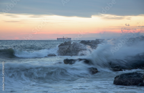 Wave in rough sea at sunset  long exposure
