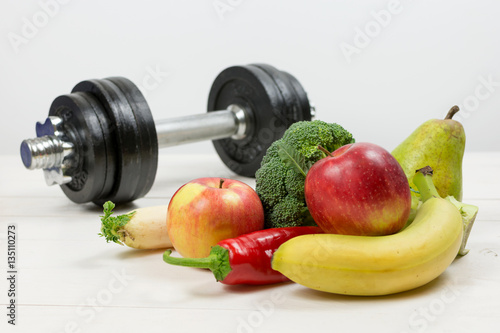Healthy lifestyle concept. Eat fruits and vegetables and workout