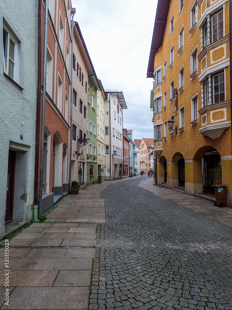 Colorful houses line this cobbled street in the traditional German town of Fussen.
