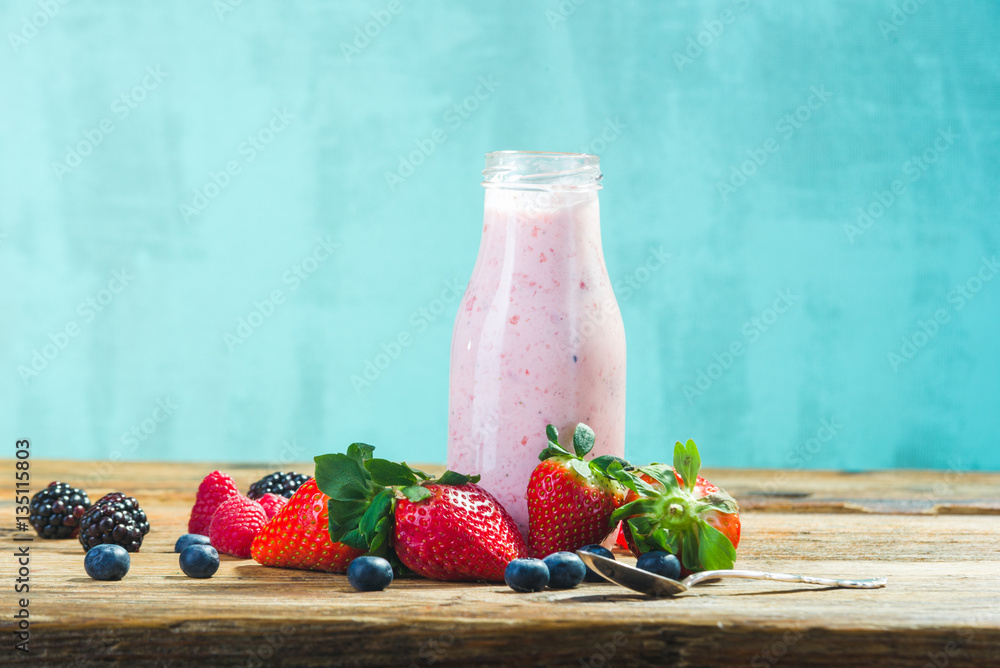 Bottles of fruits yogurt with fresh fruits. Stock Photo | Adobe Stock