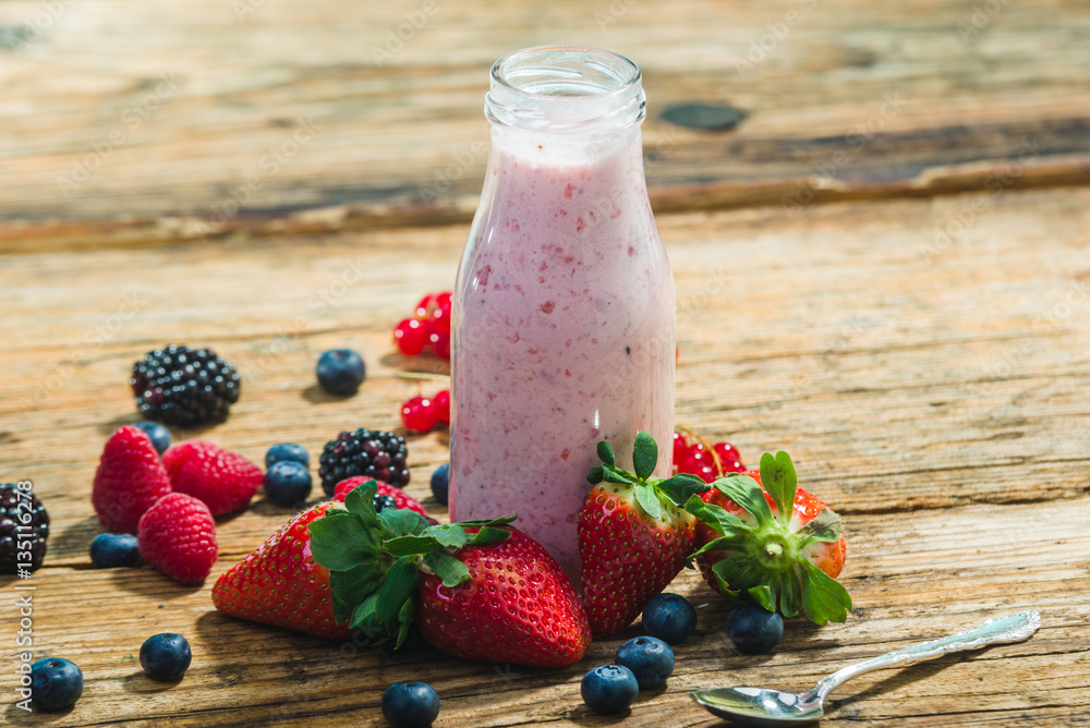 Bottles of fruits yogurt with fresh fruits. Bottles of fruits yogurt with fresh fruits.