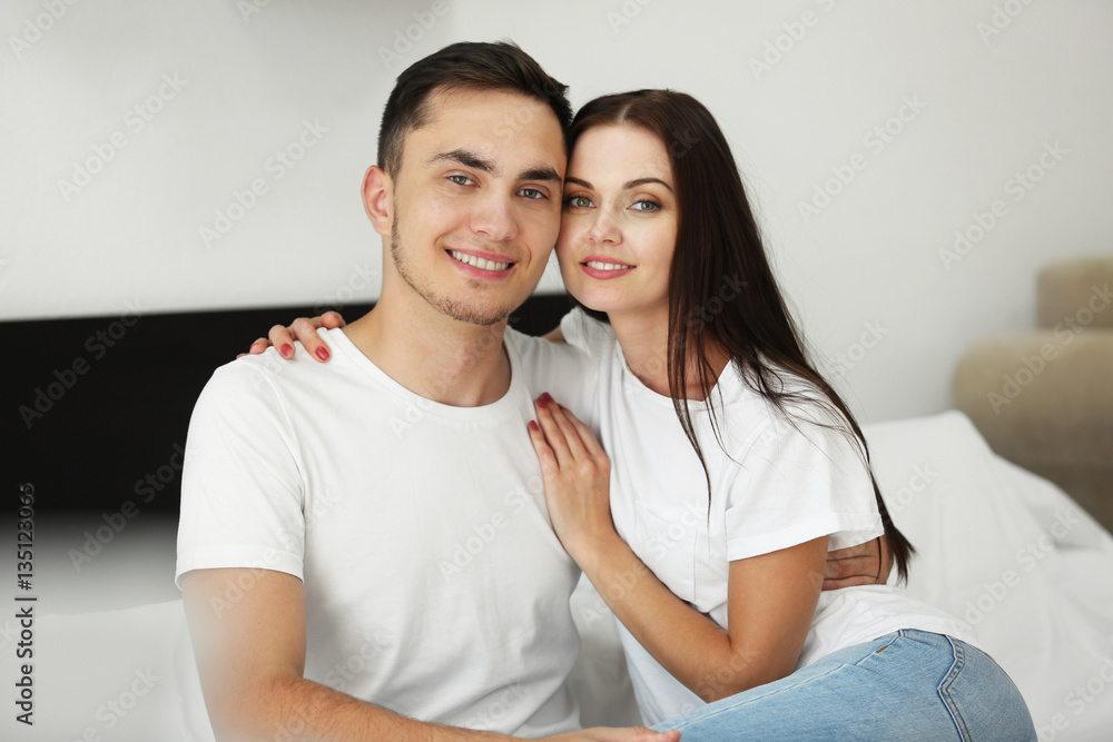 Happy couple hugging at home Happy couple hugging at home