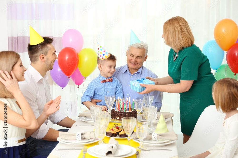 Family celebrating grandfather's birthday together Family celebrating grandfather's birthday together