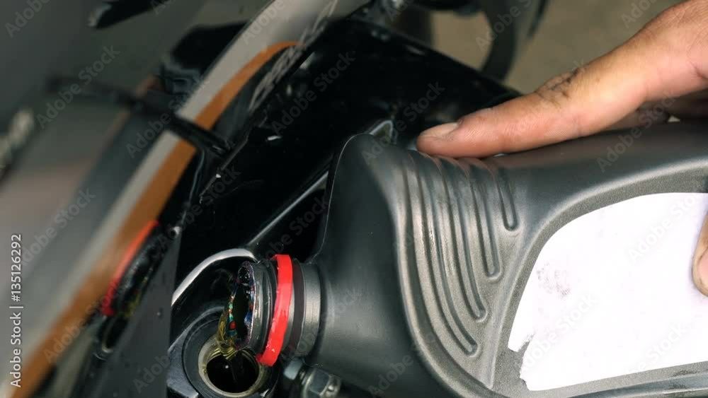 Close up shot of pouring motor oil, Engine lubrication Close up shot of pouring motor oil, Engine lubrication