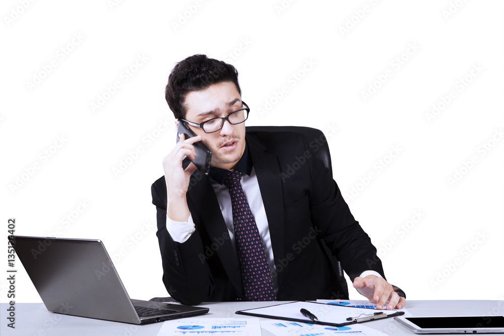 Businessman working with mobile phone and laptop Businessman working with mobile phone and laptop