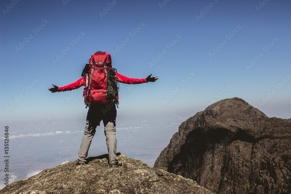 A women celebrating their arrival at the top of the mountain