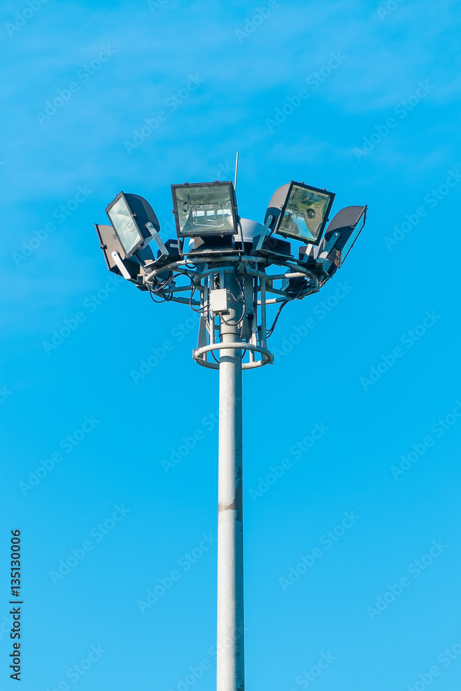 Outdoor spot light post, spot light in the blue sky. Outdoor spot light post, spot light in the blue sky.