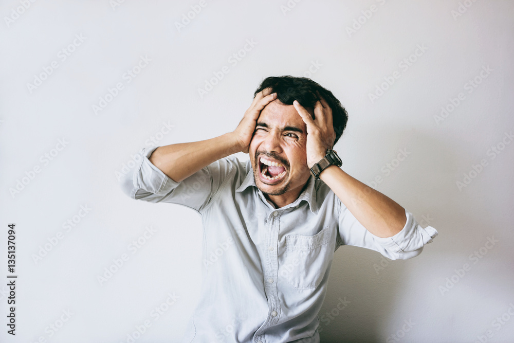 Soft focus Closeup sad young man with worried stressed face expression and brain melting into lines question marks. Obsessive compulsive, adhd, anxiety disorders