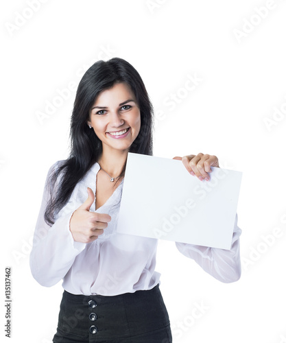 Young, attractive, successful business woman showing card and thumbs up