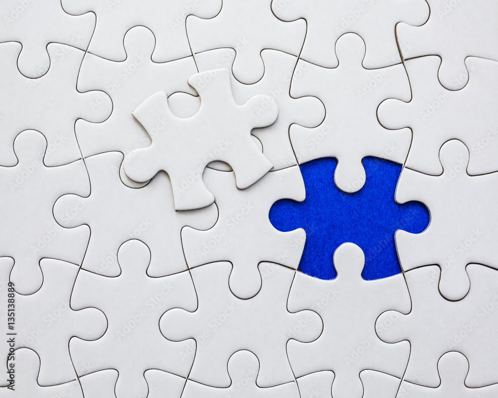 White puzzle elements on a blue background. White puzzle elements on a blue background.