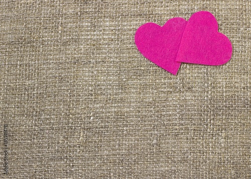 A two decorative pink hearts on gray background