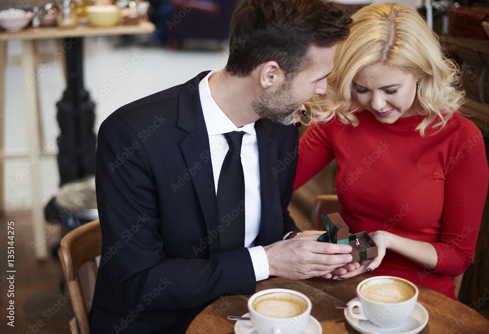 Scene of couple engagement on the coffee bar