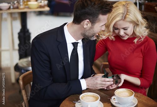 Scene of couple engagement on the coffee bar