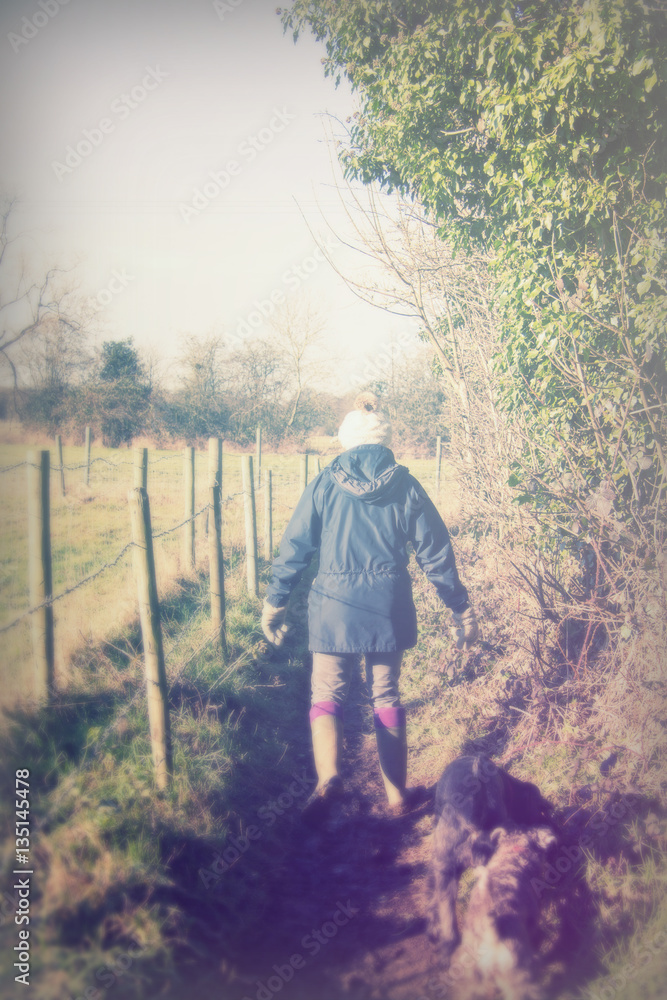 Beautiful woman walking dogs in the countryside Beautiful woman walking dogs in the countryside