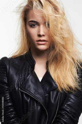 beautiful blond girl in leather coat
