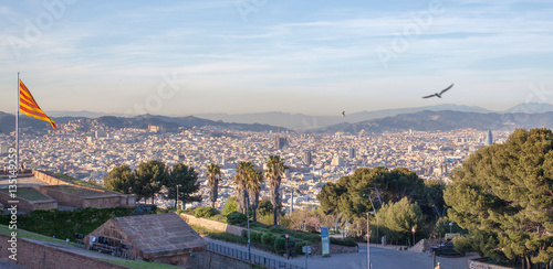 Photography Aerial view of Barcelona city with flag