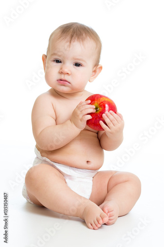 Eight month old baby sittin...