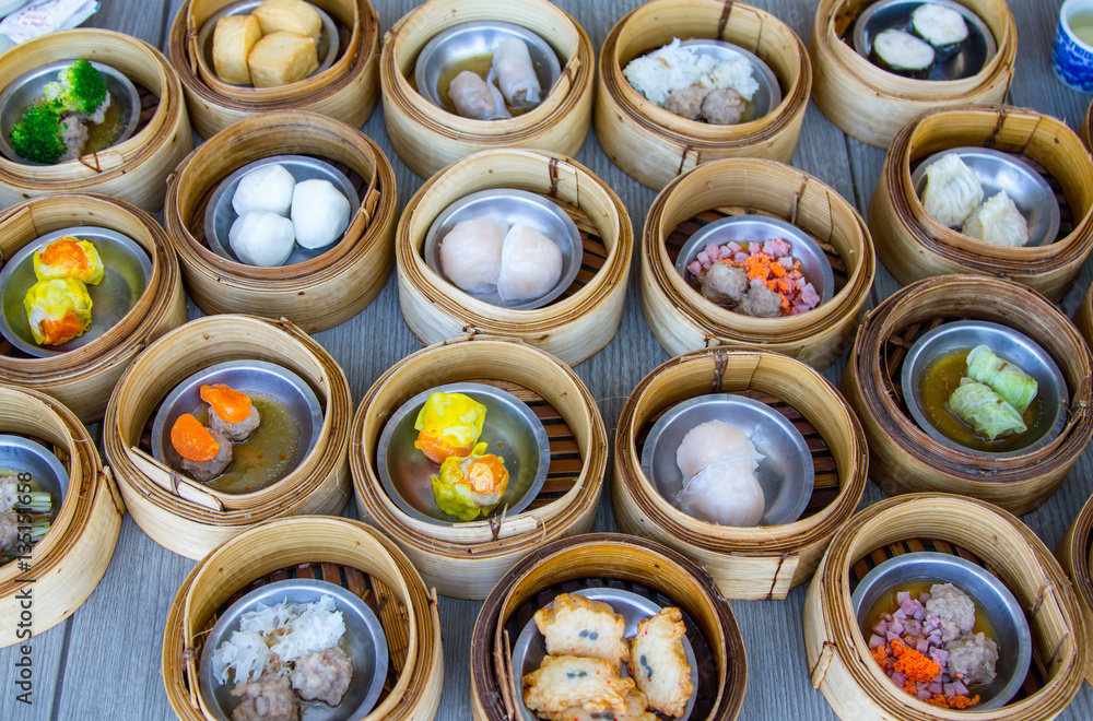 various dim sum in bamboo steamer in chinese restaurant various dim sum in bamboo steamer in chinese restaurant