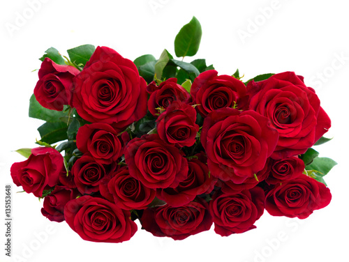 Bouquet of fresh dark red rose buds with green leaves, top view, isolated on white background