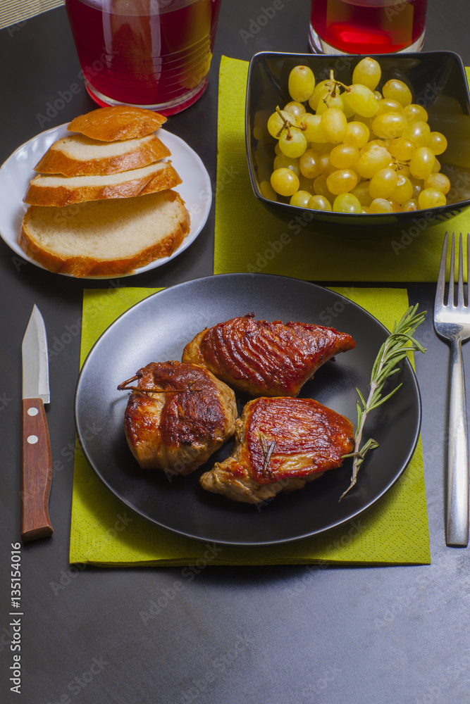 meat with rosemary on a decorated table meat with rosemary on a decorated table