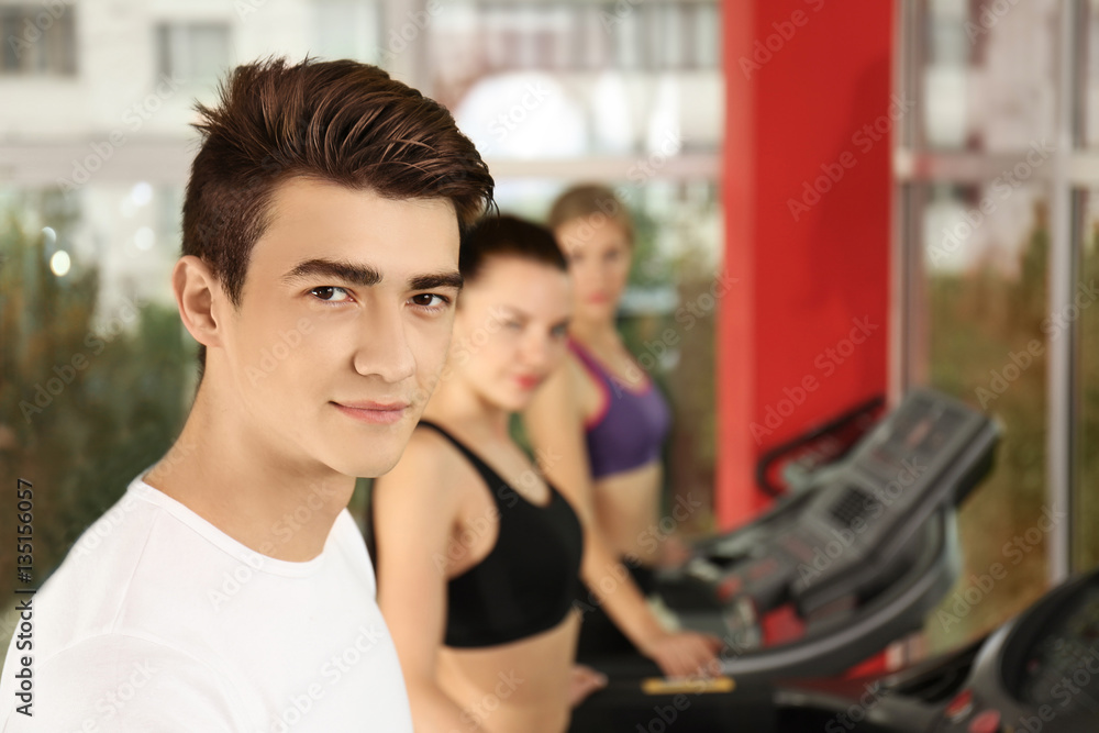 Portrait of handsome young man in gym Portrait of handsome young man in gym