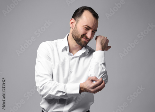 Handsome man suffering from...