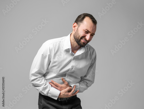 Handsome man suffering from...