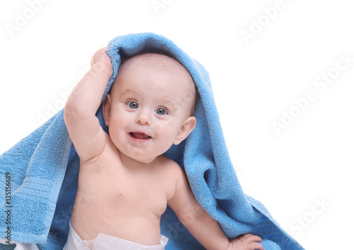 Cute baby with towel on whi...