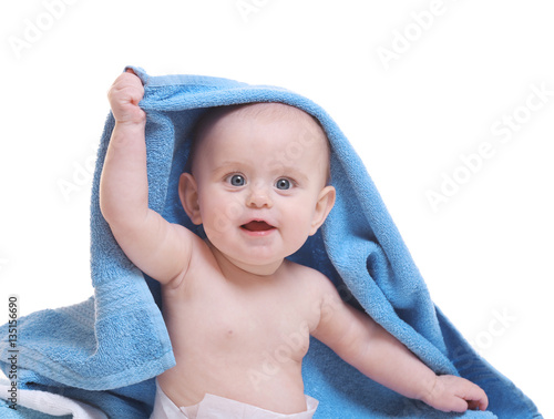 Cute baby with towel on whi...
