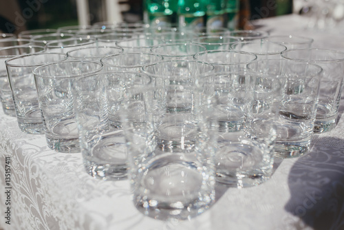 lot of empty glasses on a table outdoors