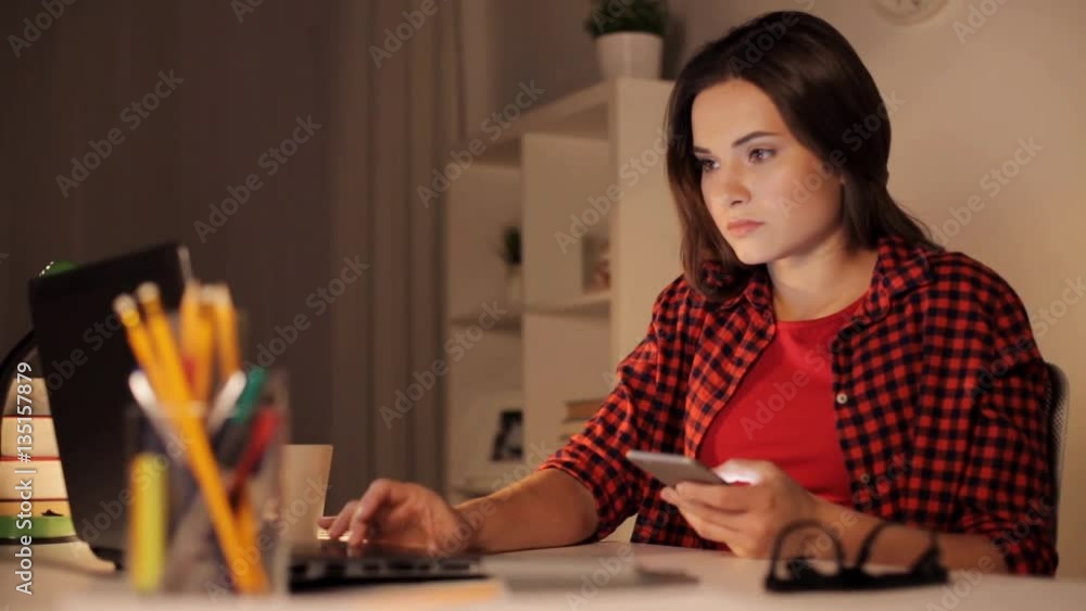 student woman with laptop and smartphone at home student woman with laptop and smartphone at home