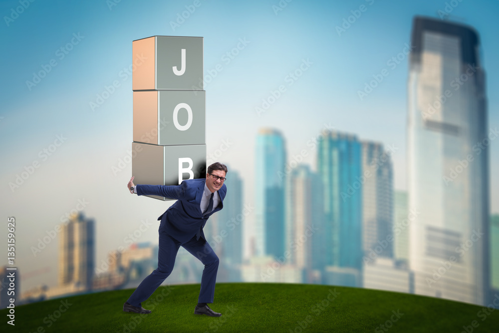 Businessman carrying the burden of his job Businessman carrying the burden of his job