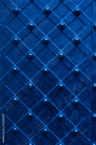 blue metal texture door with rivets