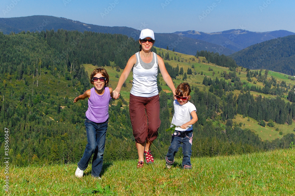 Happy active family on summer vacation in mountains. Smiling mother and kids having fun outdoors
Happy active family on summer vacation in mountains. Smiling mother and kids having fun outdoors
