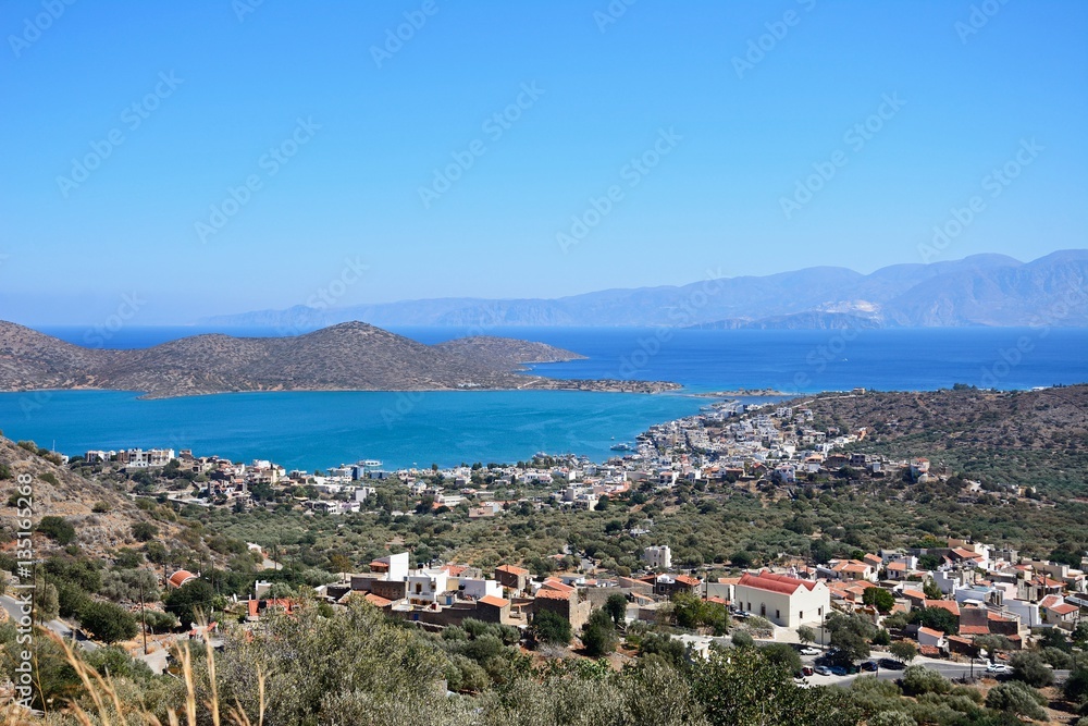 Elevated view of Elounda with views across the sea towards the island of Spinalonga, Elounda, Crete.