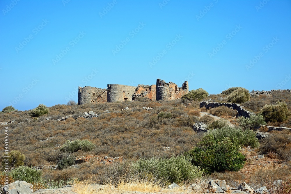 Windmill ruins on a hillside near Elounda, Crete.