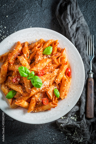Tasty pasta bolognese with parmesan and basil