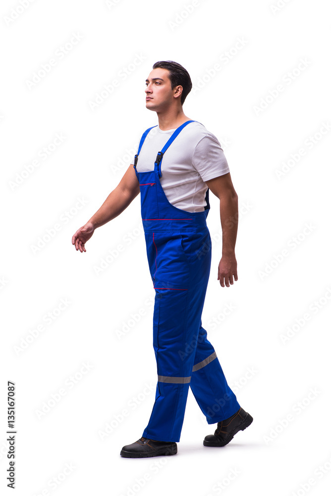 Fototapeta premium Handsome repairman wearing blue coveralls on white
