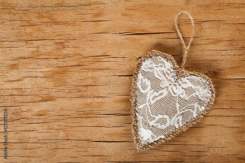 Heart made of cloth on wood desk